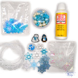 Create magical winter-themed crafts with the Winter Wonderland Craft Kit! This kit includes mod podge, snowflake ribbon trim, crystal snowflakes, and a variety of beads