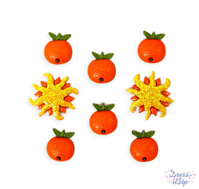 Fresh oranges and glittery suns are perfect for summer crafts and kitchen decor