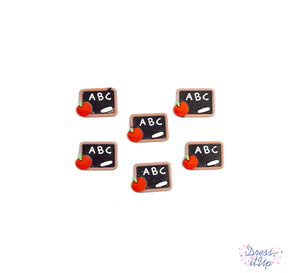 five soft resin flatback chalkboard school themed craft embellishments.