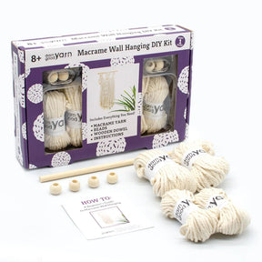 This Macrame Wall Hanging DIY Kit by Darn Good Yarn includes instructions and all materials for making your own wall art. Cotton macrame cord and wooden beads.
