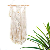 This Macrame Wall Hanging DIY Kit by Darn Good Yarn includes instructions and all materials for making your own wall art. Cotton macrame cord and wooden beads.