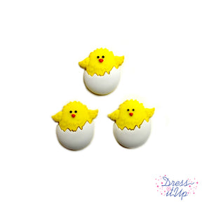 This six piece button pack featuring yellow easter chick hatching out of eggs for easter crafting