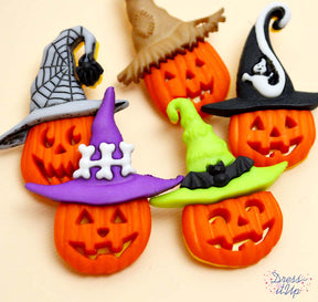 Orange Jack-o-Lanterns are dressed up in hats ready for Halloween crafts