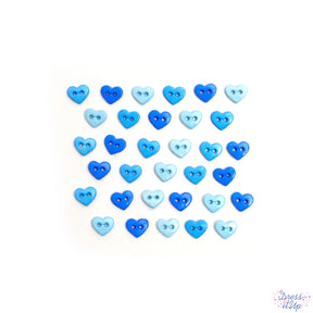 Shades of blue adorn these heart shaped sew-thru buttons for sewing and crafting