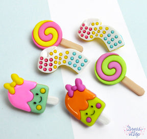 Popsicles, lollypops and candy buttons in bright colors add to summer and children's crafting