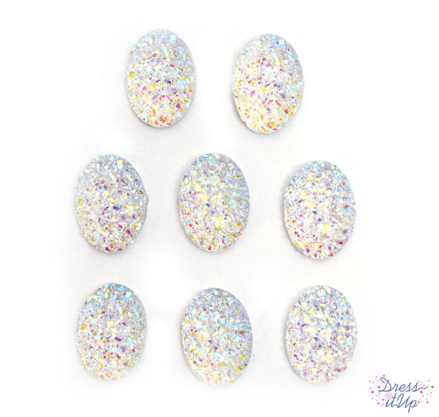 Resin oval shaped embellishments add rainbow sparkle to crafts and projects